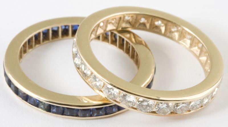 Appraisal: Two KT Diamond and Sapphire Eternity Bands the first with