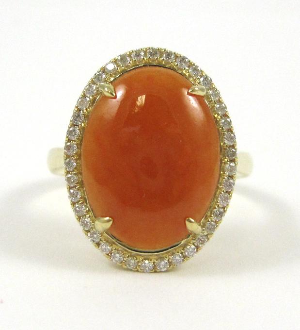 Appraisal: ORANGE JADE AND FOURTEEN KARAT GOLD RING with round-cut diamonds