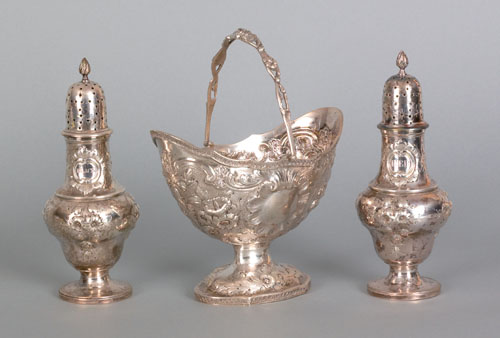 Appraisal: Pair of New York repousse silver pepper shakers and a