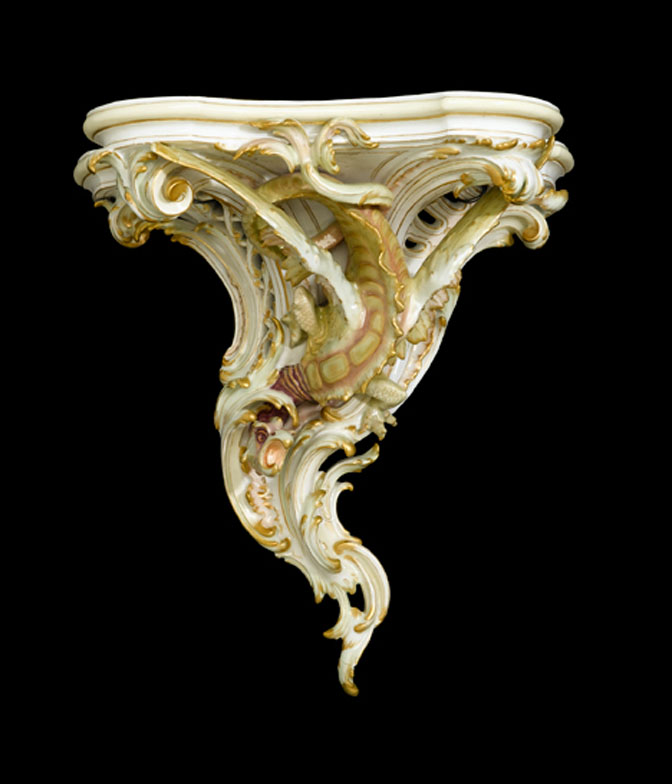 Appraisal: KPM porcelain wall-bracket Molded with a winged dragon surrounded by