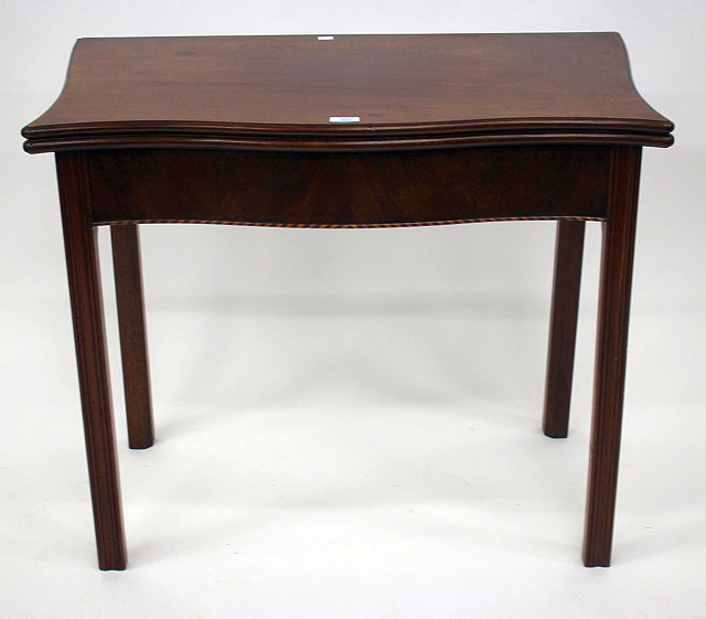 Appraisal: A TH CENTURY MAHOGANY SERPENTINE FOLD OVER CARD TABLE cm