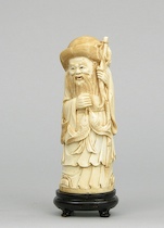 Appraisal: A Carved Ivory Figurine of an Elderly Man A carved