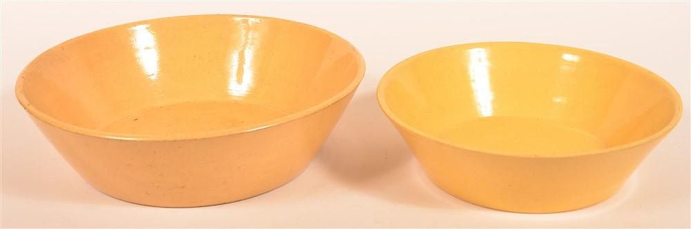 Appraisal: Two Yellowware Nappy Bowls Two Yellowware Nappy Bowls Large is