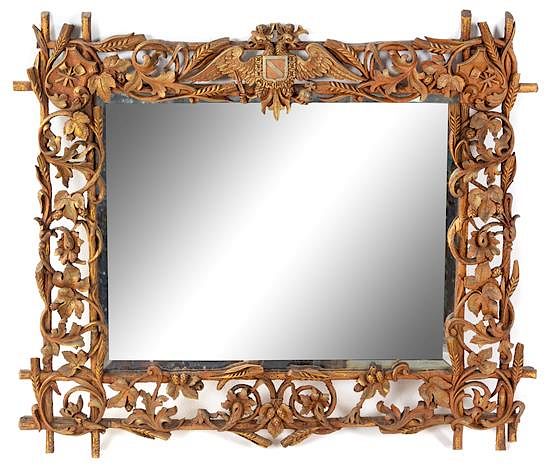 Appraisal: A Black Forest Carved Mirror Height x width inches A