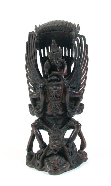 Appraisal: An Indonesian carved wood figure height in width in depth