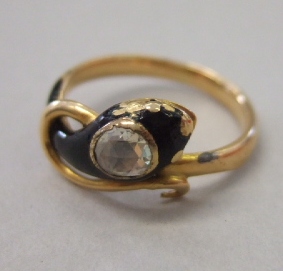 Appraisal: A gold black enameled and diamond set single stone ring