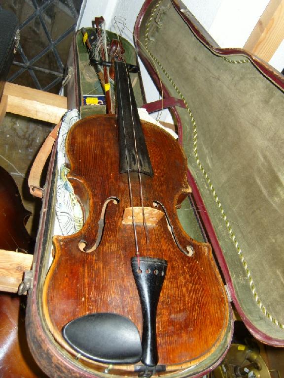 Appraisal: A cased violin together with two bows -