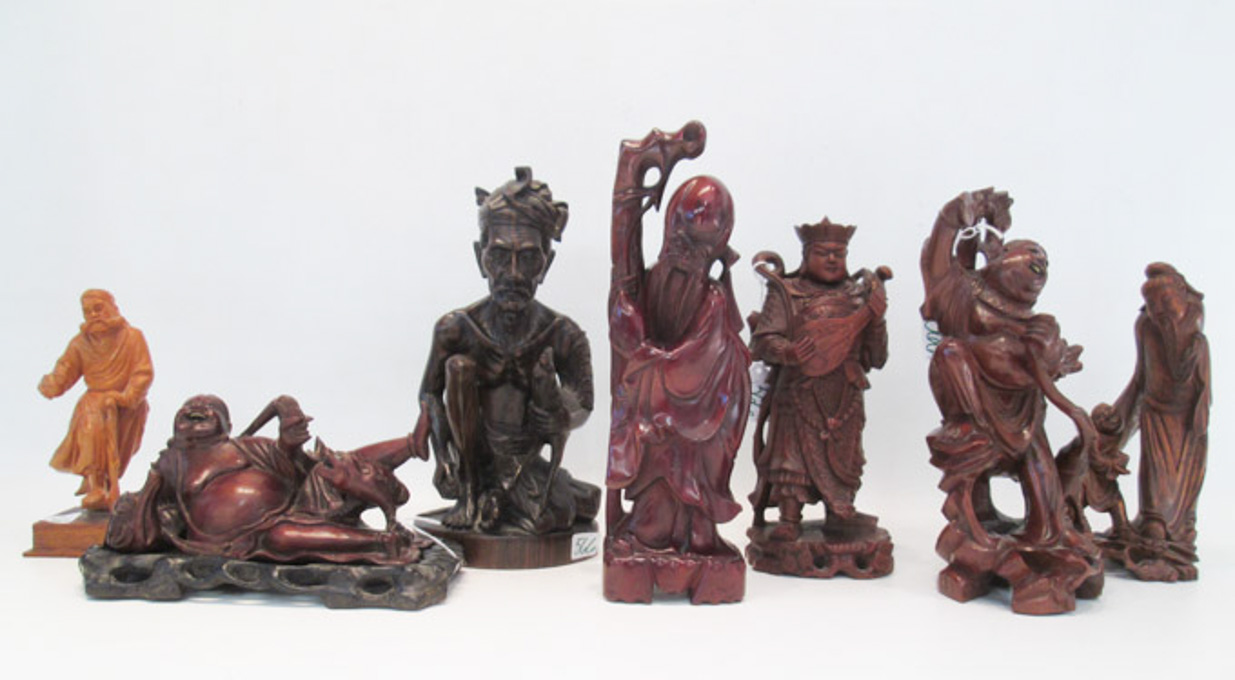 Appraisal: SEVEN CHINESE CARVED WOOD FIGURAL SCULPTURES including variety of Immortals