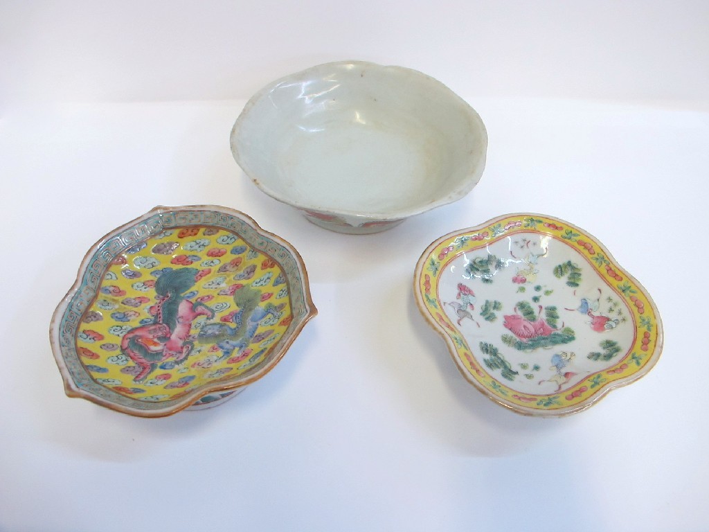 Appraisal: Three Chinese dishes one decorated with Koi one with Shishi