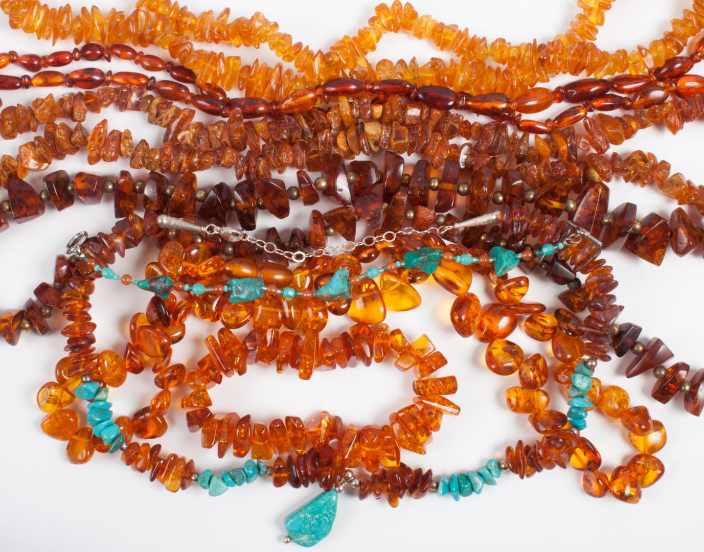 Appraisal: Group of amber jewelry items including five necklaces longest- in