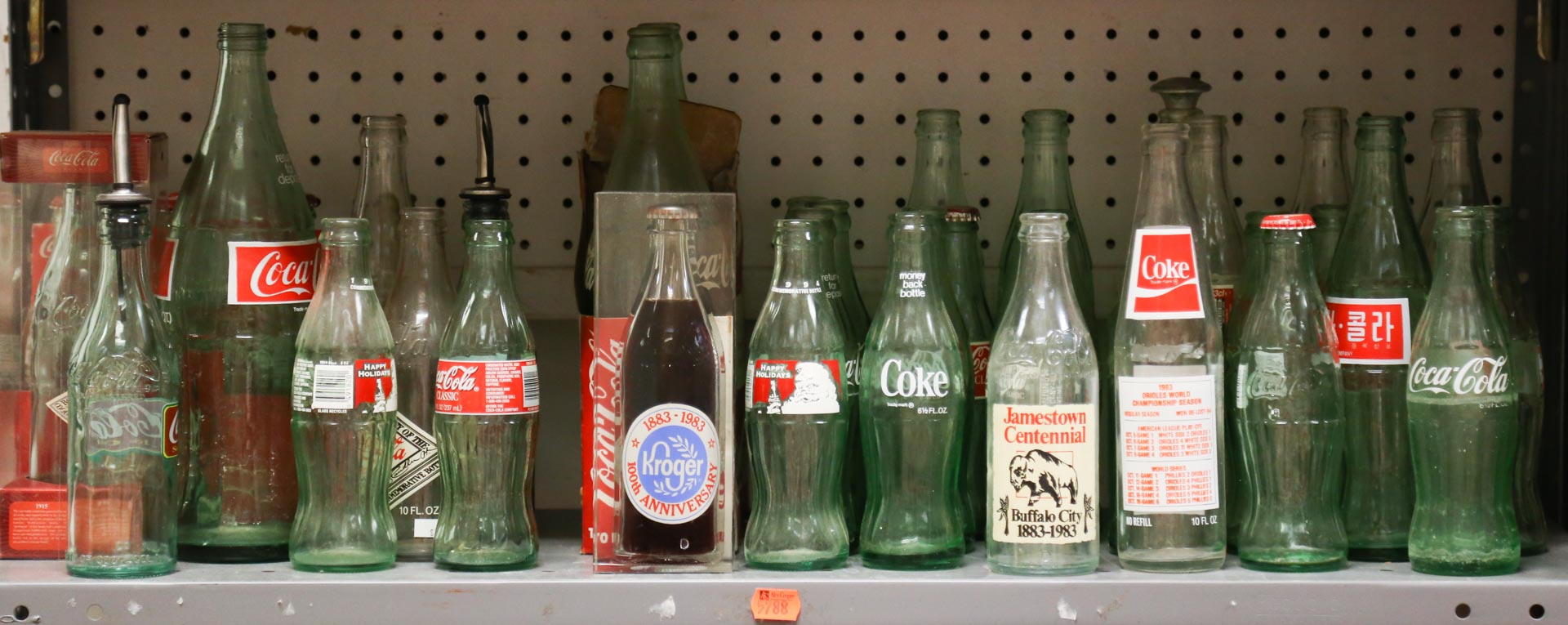 Appraisal: Shelf of Coca-Cola bottles Undernumber