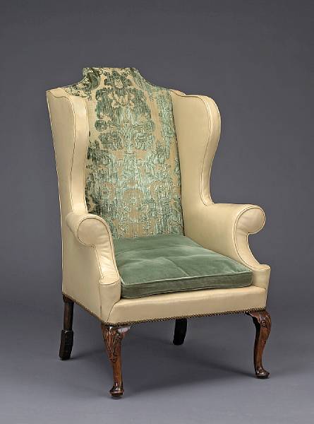 Appraisal: A George II mahogany and leather upholstered wing chair second