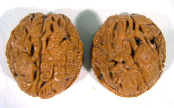 Appraisal: Walnut heavily carved with Oriental style figures Dog of Foo