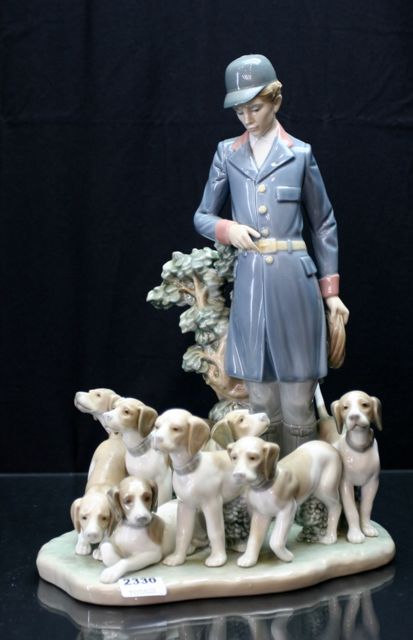 Appraisal: A Lladro figural group of a hunter with eight hounds