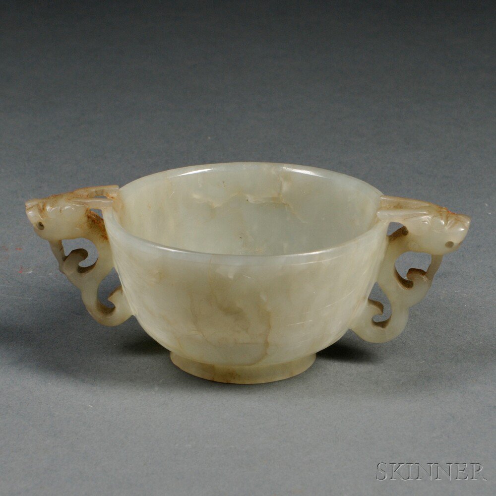 Appraisal: Miniature Jade Bowl China decorated with dragon handles the exterior