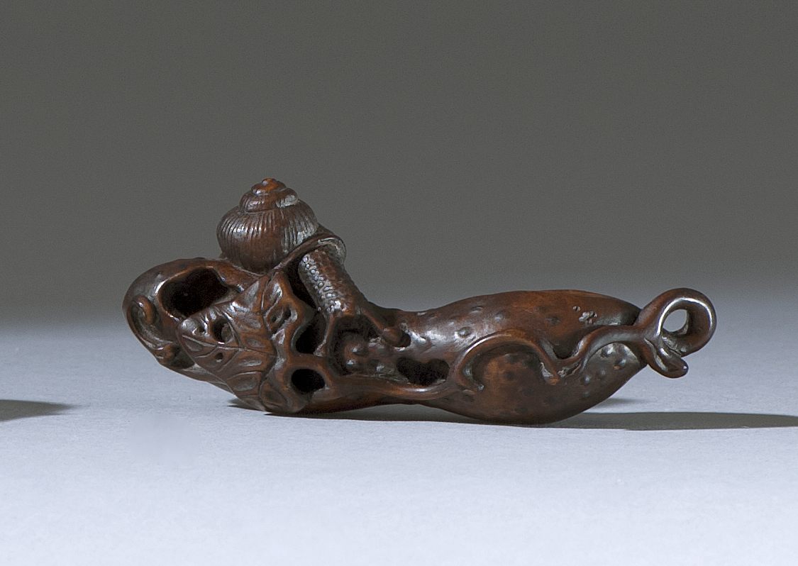 Appraisal: WOOD NETSUKE Meiji PeriodIn the form of a snail exploring