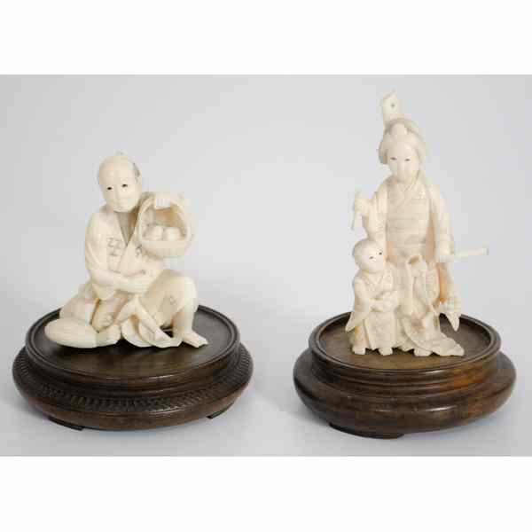 Appraisal: Pair of Ivory Japanese Figural Carvings A pair of th