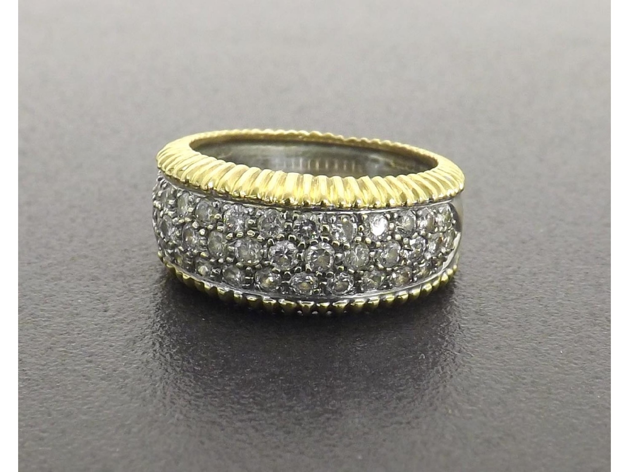 Appraisal: Modern ct yellow and white gold diamond band ring round