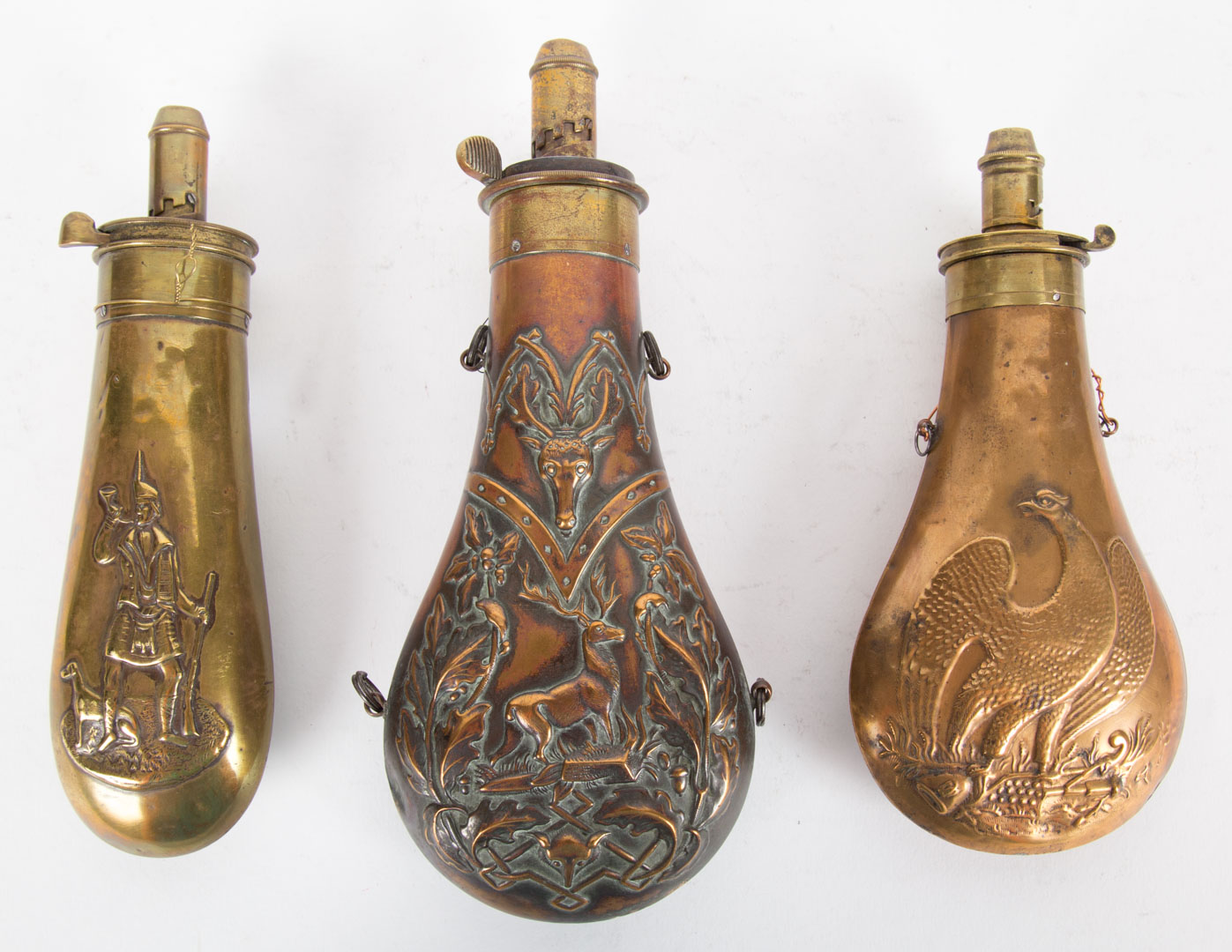 Appraisal: Two brass and copper and one brass powder horn th