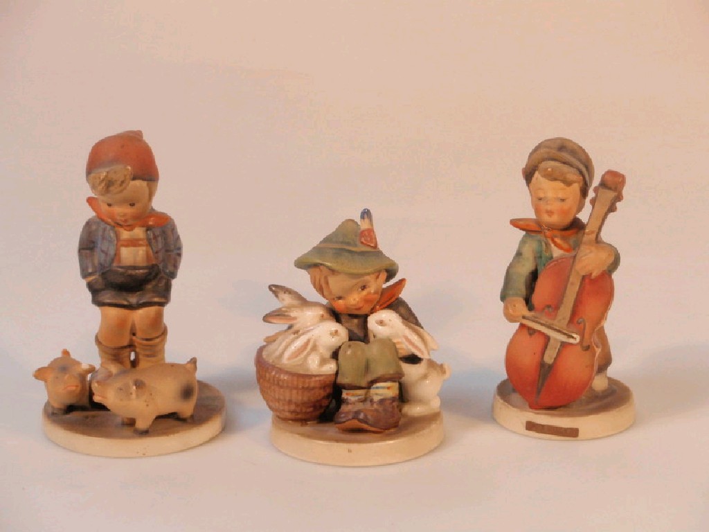 Appraisal: Three Hummel figures Farm Boy Boy with Rabbits Sweet Music