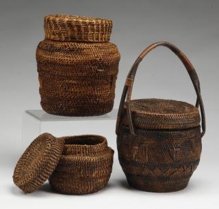 Appraisal: African baskets with covers Three African baskets with covers comprised