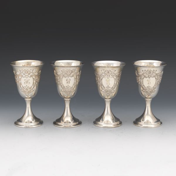 Appraisal: FOUR DUNKIRK SILVERSMITHS STERLING SILVER HAND CHASED GOBLETS Bell shape