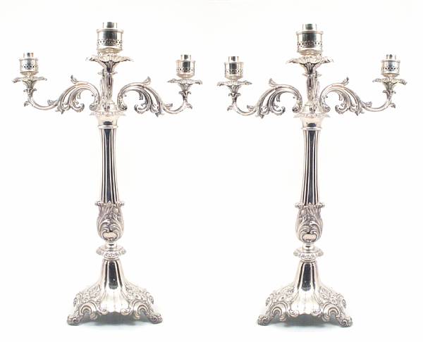 Appraisal: A pair of Victorian plated three arm four light candelabra