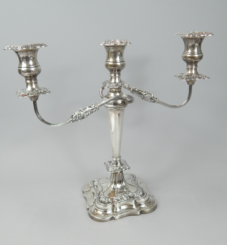 Appraisal: An Elizabeth II three branch silver candelabra decorated with rococo