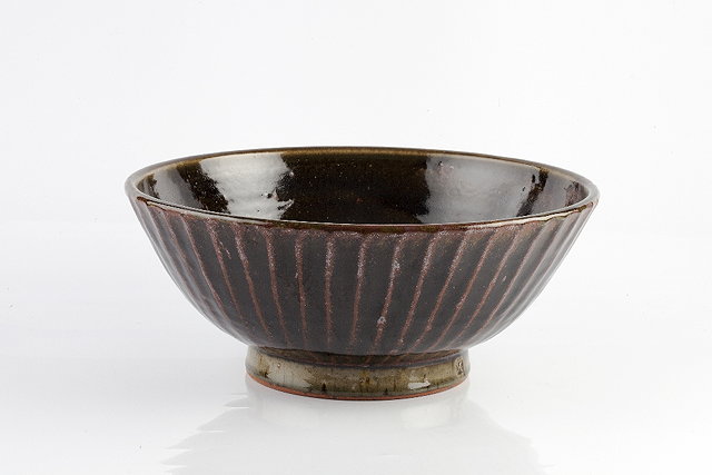 Appraisal: Edward Hughes British - Bowlfluted tenmoku and ash glazeimpressed potter's