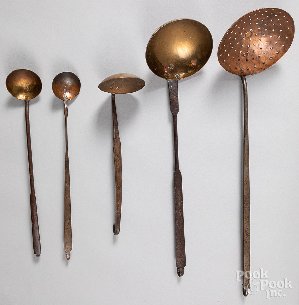 Appraisal: Five wrought iron brass and copper ladles Five wrought iron