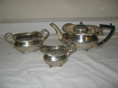 Appraisal: A THREE PIECE TEASET of waisted oblong form the teapot