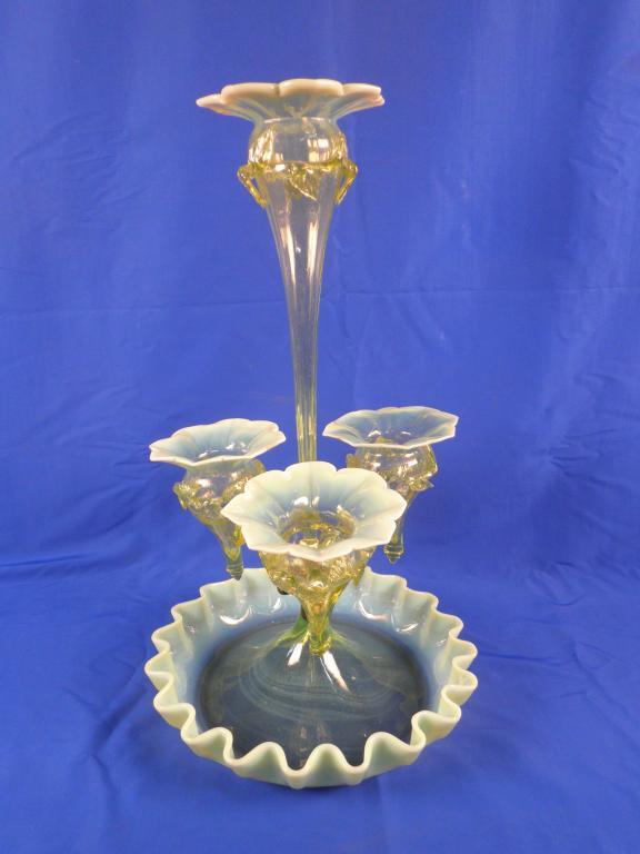 Appraisal: A Victorian vaseline glass epergne with four tulip shaped vases