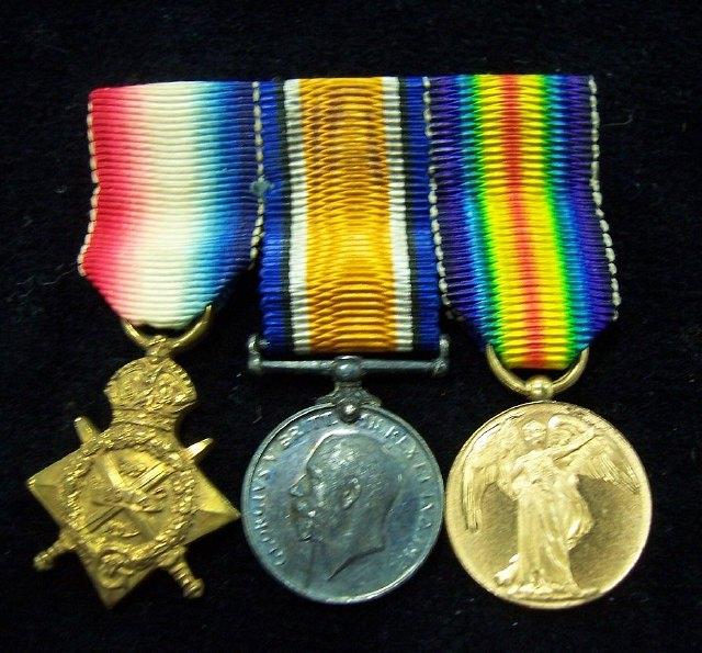 Appraisal: MINIATURE MEDALS A mounted group of three First World War