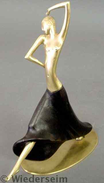 Appraisal: Hagenauer brass and ebonized wood dancing figure c mounted on