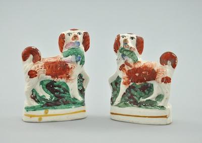 Appraisal: A Small Pair of Staffordshire Spaniels Each hand decorated in