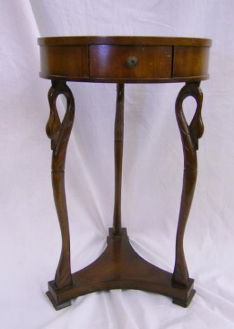 Appraisal: Swan motif mahogany side table with round top