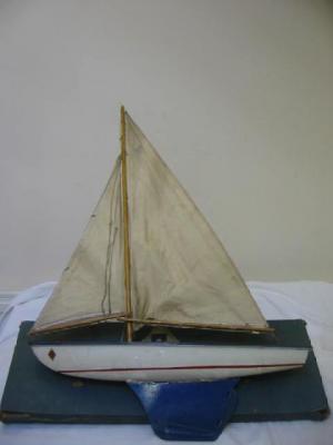 Appraisal: A B Boats model yacht painted tin hull wooden deck