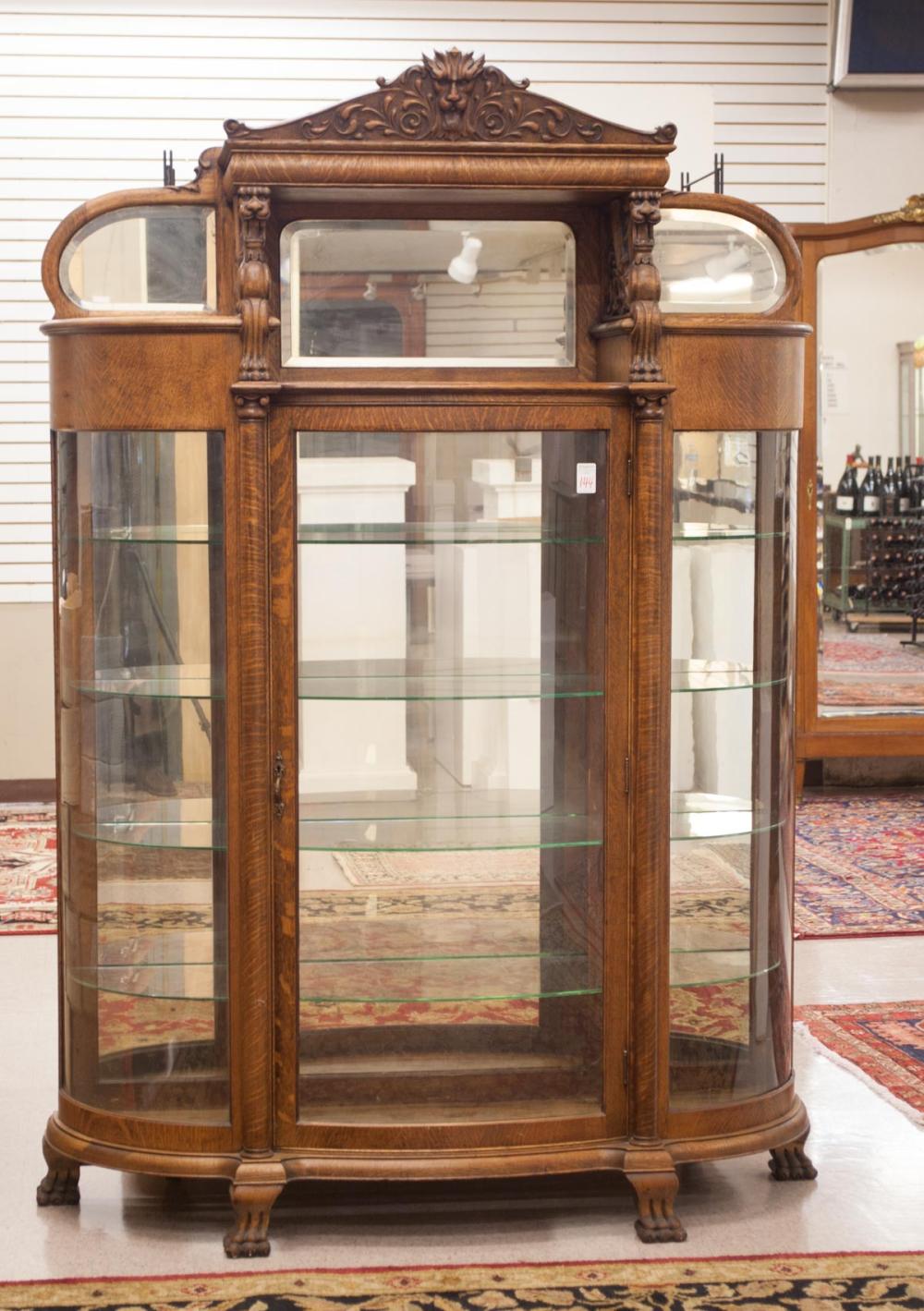 Appraisal: LATE VICTORIAN CARVED OAK AND CURVED GLASS CHINA CABINET American