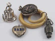 Appraisal: Four silver baby rattles including one of a soldier AF