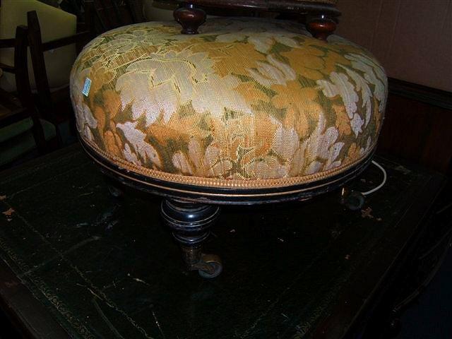 Appraisal: A Victorian circular stool the ebonised frame on turned legs