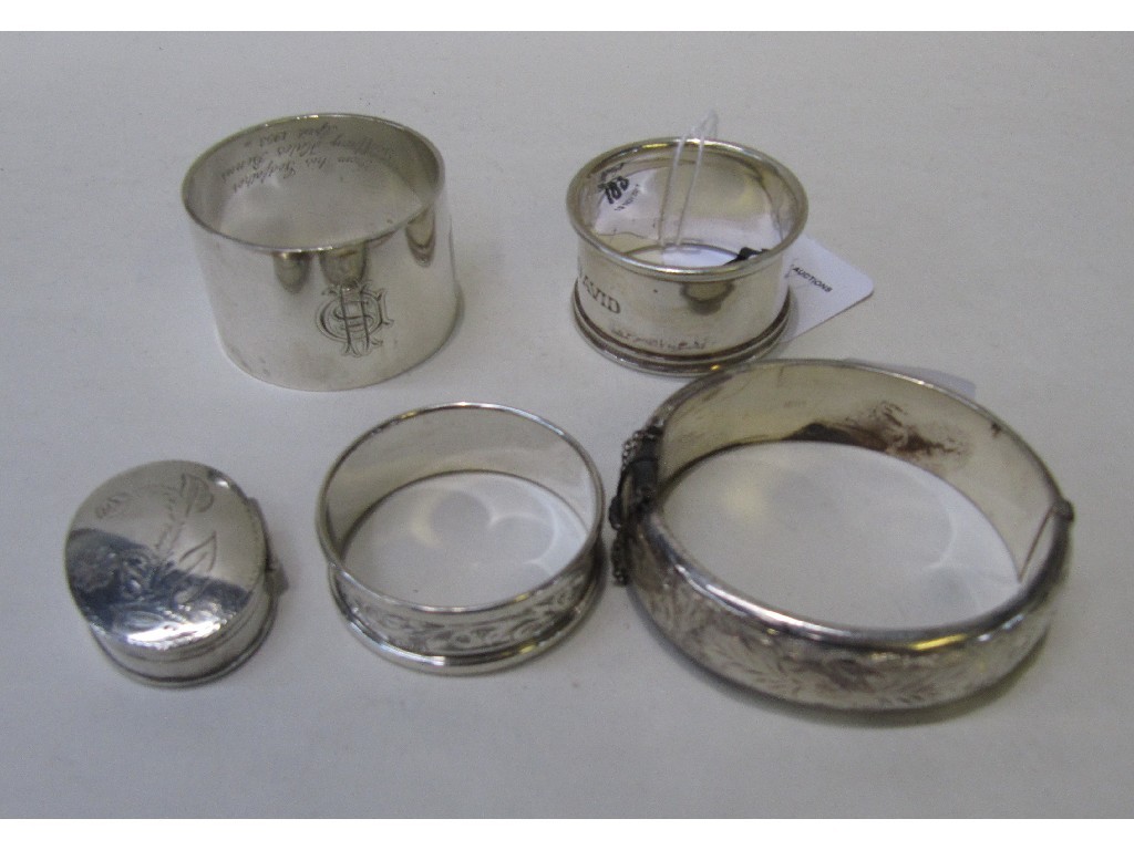 Appraisal: Lot comprising three silver napkin rings a silver bracelet and