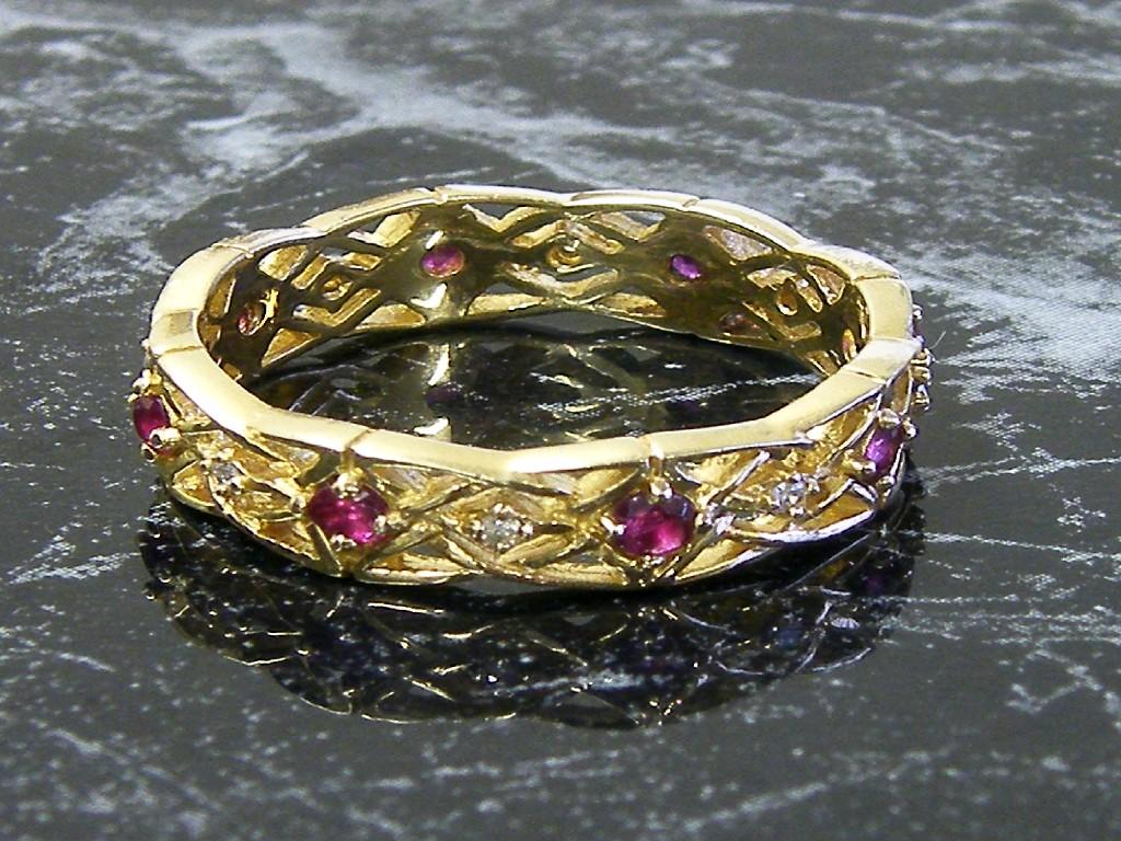 Appraisal: Givenchy k diamond and gem set eternity ring gm size