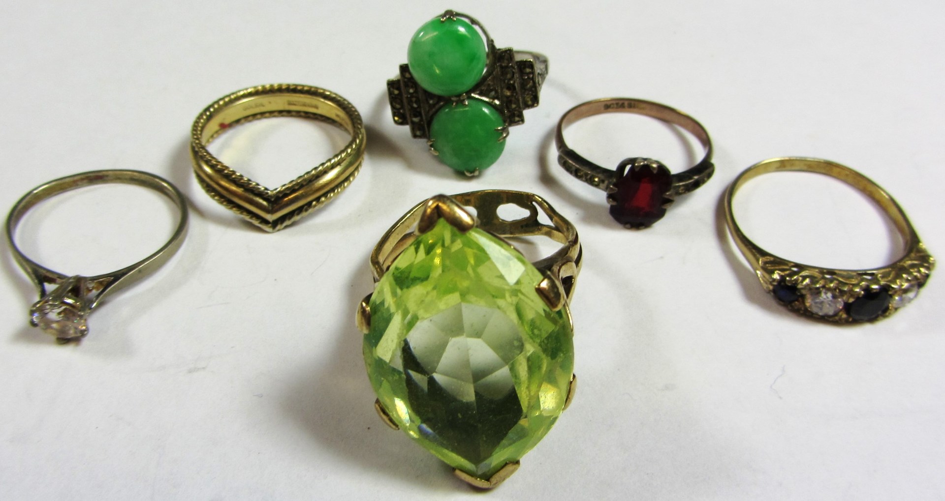 Appraisal: A jade and marcasite set ring mounted with two circular