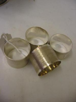 Appraisal: A MATCHED SET OF THREE NAPKIN RINGS of circular form