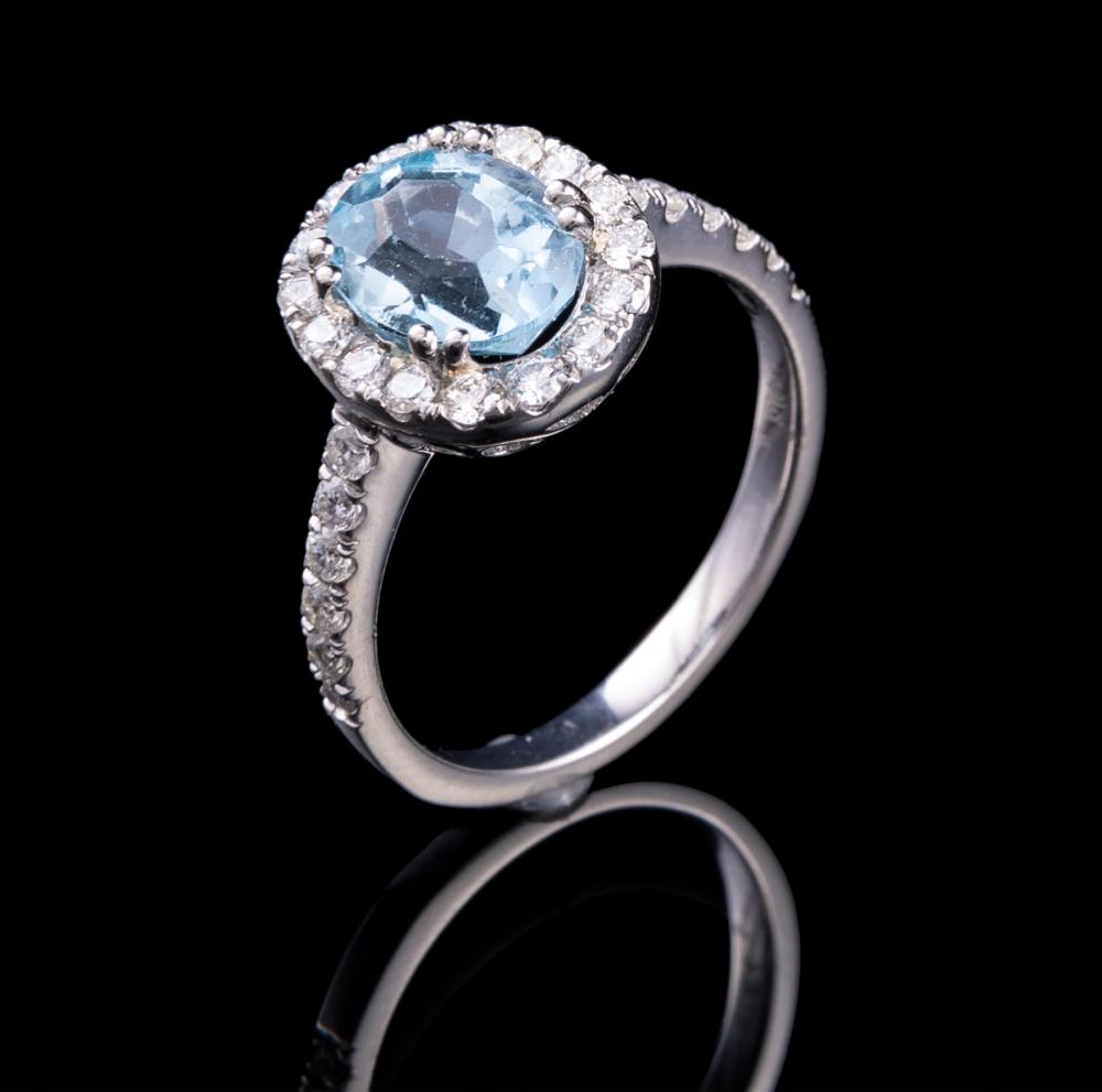 Appraisal: Platinum Aquamarine and Diamond Ring central prong set oval cut