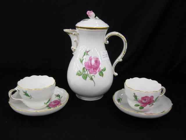 Appraisal: Meissen Porcelain Coffeepot with Two Cups saucers rose decor crossed