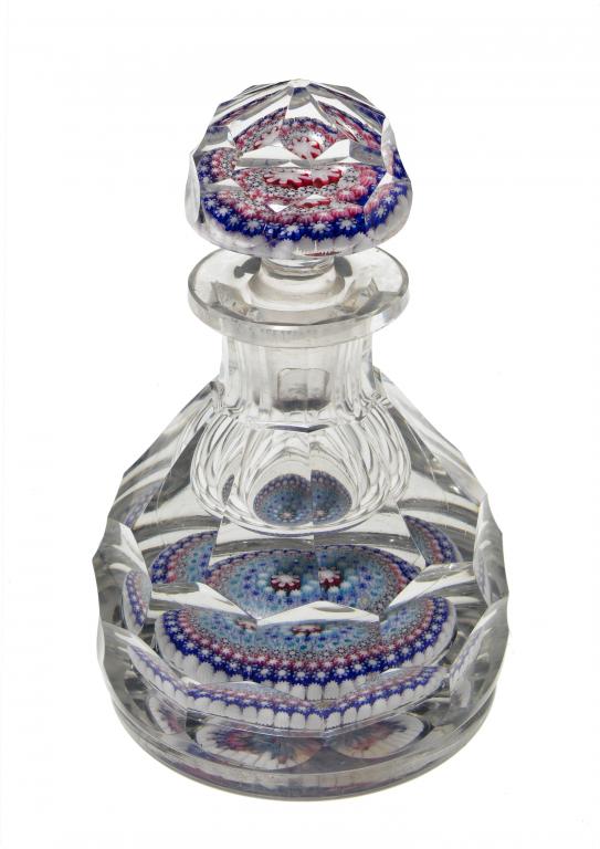 Appraisal: A BACCARAT FACETED MILLEFIORE INKWELL PAPEREWEIGHT AND STOPPER with white