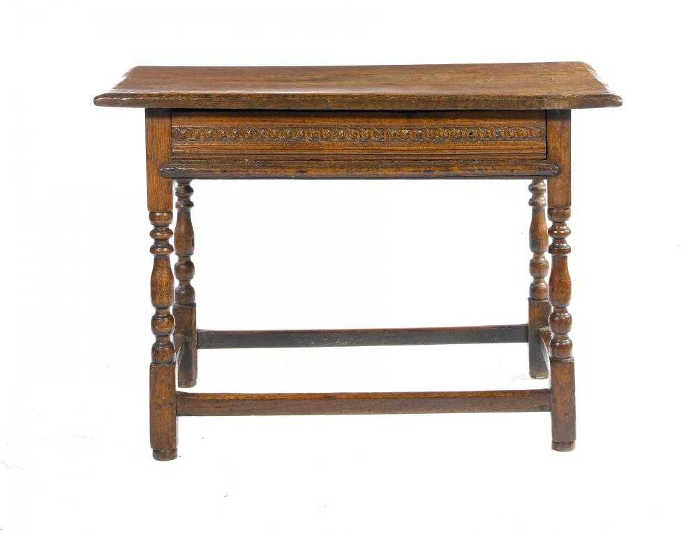 Appraisal: A WILLIAM III OAK SIDE TABLE with substantial chamfered top