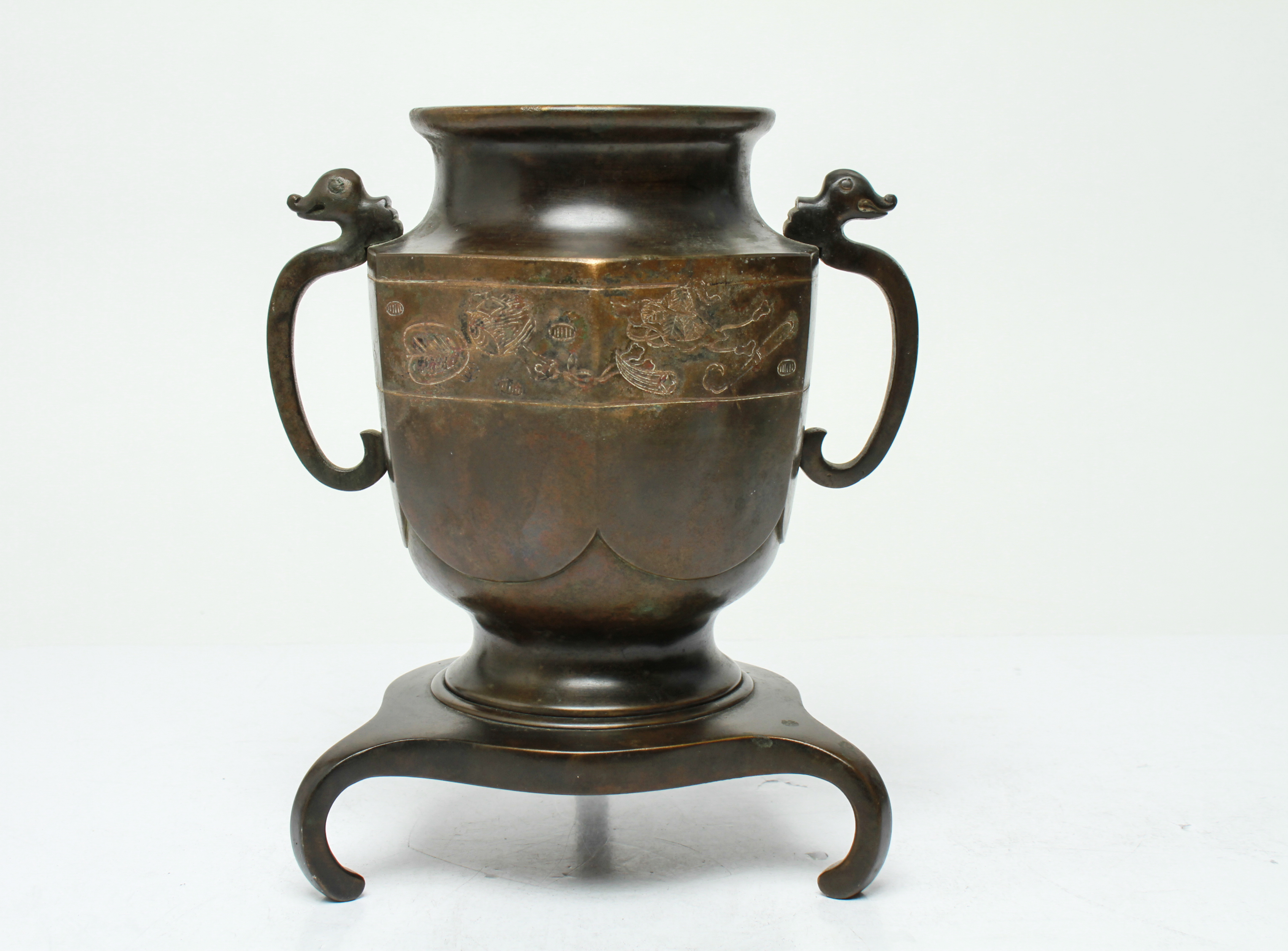 Appraisal: JAPANESE MEIJI BRONZE URN ON TRIPOD STAND Japanese Meiji patinated