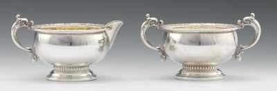 Appraisal: A Sterling Silver Sugar Bowl and Creamer Each with dolphin